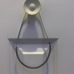 Necklace with leather detail